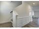 Elegant staircase with crisp white trim and hardwood floors at 3505 Triad Ct, Raleigh, NC 27604
