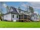 Beautiful home exterior showcasing a spacious backyard, lush green lawn, and a screened porch at 3909 Cedar Knolls Dr # 6, Youngsville, NC 27596