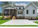 Charming home exterior with a cozy porch, lush lawn, and manicured landscaping at 3909 Cedar Knolls Dr # 6, Youngsville, NC 27596