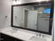 Bathroom featuring double vanity with undermount sinks and a framed mirror at 3909 Cedar Knolls Dr # 6, Youngsville, NC 27596