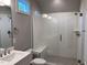 Bathroom featuring tiled shower with glass door and single vanity at 3909 Cedar Knolls Dr # 6, Youngsville, NC 27596