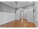 Bedroom features wood floors, stylish wainscotting, and access to the modern bath at 3909 Cedar Knolls Dr # 6, Youngsville, NC 27596