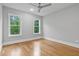 Bedroom features wood floors and a beautiful view from the double windows at 3909 Cedar Knolls Dr # 6, Youngsville, NC 27596