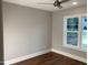 Bedroom featuring hardwood floors, large window, and neutral paint at 3909 Cedar Knolls Dr # 6, Youngsville, NC 27596