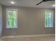 Bedroom featuring a ceiling fan, neutral walls, and two large windows at 3909 Cedar Knolls Dr # 6, Youngsville, NC 27596