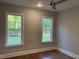Cozy bedroom featuring two large windows providing natural light at 3909 Cedar Knolls Dr # 6, Youngsville, NC 27596