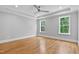 Bright and airy bedroom with hardwood floors, tray ceiling, and large windows at 3909 Cedar Knolls Dr # 6, Youngsville, NC 27596