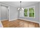 Dining area with large windows offering a beautiful outdoor view and stylish light fixture at 3909 Cedar Knolls Dr # 6, Youngsville, NC 27596