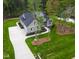 New construction home featuring a landscaped yard, long driveway, and gray siding at 3909 Cedar Knolls Dr # 6, Youngsville, NC 27596