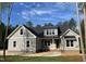 Charming craftsman-style home with gray siding, a stone foundation, and a well-manicured lawn at 3909 Cedar Knolls Dr # 6, Youngsville, NC 27596
