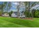 New construction home boasting lush landscaping, a gray exterior, and a sprawling lawn at 3909 Cedar Knolls Dr # 6, Youngsville, NC 27596