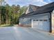Home exterior with gray siding and a two-car garage at 3909 Cedar Knolls Dr # 6, Youngsville, NC 27596