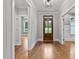 Foyer featuring hardwood floors, neutral walls, wood door, and a stylish light fixture at 3909 Cedar Knolls Dr # 6, Youngsville, NC 27596