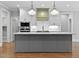 Island kitchen features stainless appliances, undermount sink and ample cabinets at 3909 Cedar Knolls Dr # 6, Youngsville, NC 27596