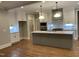 Bright kitchen features an island, white cabinets, and modern appliances at 3909 Cedar Knolls Dr # 6, Youngsville, NC 27596