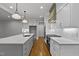 Spacious kitchen featuring a large island, stainless appliances, and pendant lighting at 3909 Cedar Knolls Dr # 6, Youngsville, NC 27596