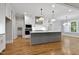 Bright kitchen featuring a large island, stainless appliances, and pendant lighting at 3909 Cedar Knolls Dr # 6, Youngsville, NC 27596