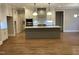 Spacious kitchen with center island, pendant lights, and stainless appliances at 3909 Cedar Knolls Dr # 6, Youngsville, NC 27596