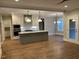 Kitchen features an island, white cabinets, stainless appliances at 3909 Cedar Knolls Dr # 6, Youngsville, NC 27596