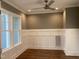Living area has hardwood floors, neutral walls, wainscoting and lots of natural light at 3909 Cedar Knolls Dr # 6, Youngsville, NC 27596