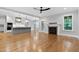 Open-concept living room with fireplace flowing into kitchen with island and lots of natural light at 3909 Cedar Knolls Dr # 6, Youngsville, NC 27596