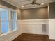 Living area has hardwood floors, neutral walls, wainscoting and lots of natural light at 3909 Cedar Knolls Dr # 6, Youngsville, NC 27596