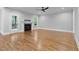 Spacious living room with hardwood floors, fireplace, neutral walls, and a door to the back patio at 3909 Cedar Knolls Dr # 6, Youngsville, NC 27596
