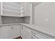 Well-organized pantry with white cabinets, drawers, and shelving for ample storage space at 3909 Cedar Knolls Dr # 6, Youngsville, NC 27596