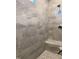 Walk-in shower featuring gray tile, a built-in bench, and a modern shower head at 3909 Cedar Knolls Dr # 6, Youngsville, NC 27596