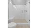 Shower stall with a glass door, subway tile walls, a tiled shower floor, and a built-in bench at 3909 Cedar Knolls Dr # 6, Youngsville, NC 27596