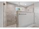 Large walk-in shower with a rain shower head, handheld wand, and frameless glass enclosure at 3909 Cedar Knolls Dr # 6, Youngsville, NC 27596