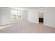 Spacious bedroom features plush carpeting, a large window for natural light, and access to an en-suite bathroom at 3920 Willow Gate Way, Raleigh, NC 27604