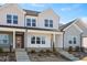 Charming new construction townhomes feature a welcoming entrance, and a meticulously landscaped front yard at 3920 Willow Gate Way, Raleigh, NC 27604