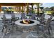 Cozy outdoor fire pit with seating, perfect for gatherings and enjoying the community's social amenities at 3920 Willow Gate Way, Raleigh, NC 27604