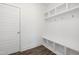 Bright mudroom boasts built-in bench seating and storage with sleek, modern design, enhancing entryway organization at 3920 Willow Gate Way, Raleigh, NC 27604