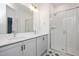 Modern bathroom with double vanity, quartz countertop, and glass-enclosed shower with white subway tile at 3928 Willow Gate Way, Raleigh, NC 27604