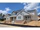 Beautiful two-story home showcasing modern architectural design with brick foundation and unfinished landscaping at 3928 Willow Gate Way, Raleigh, NC 27604