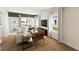 Bright living room featuring hardwood floors, neutral decor, large windows, and comfortable seating arrangement at 3928 Willow Gate Way, Raleigh, NC 27604