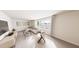 Bright living room with a plush white couch, stylish decor, and large windows overlooking the neighborhood at 3928 Willow Gate Way, Raleigh, NC 27604