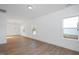 Bright living room features wood floors, white walls, recessed lighting, and natural light from windows at 3928 Willow Gate Way, Raleigh, NC 27604