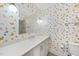 Charming bathroom with butterfly wallpaper, toilet, sink, and mirror offers a whimsical and bright atmosphere at 4329 Lambeth Dr, Raleigh, NC 27609