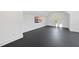 Spacious bedroom with dark floor, a window with a view, and a modern TV at 4329 Lambeth Dr, Raleigh, NC 27609