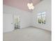 Bright bedroom with white trim, open ensuite bathroom and plush carpet flooring offers lots of light at 4329 Lambeth Dr, Raleigh, NC 27609