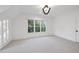 Airy bedroom with ample natural light and a neutral color palette, modern light fixture and carpeted floor at 4329 Lambeth Dr, Raleigh, NC 27609