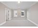 Inviting bedroom with neutral color scheme and natural light, carpeted floors and well-lit open space at 4329 Lambeth Dr, Raleigh, NC 27609