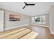 Spacious bedroom with hardwood flooring, ceiling fan and natural light streaming through windows at 4329 Lambeth Dr, Raleigh, NC 27609