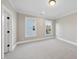 Inviting bedroom with neutral color scheme and natural light, carpeted floors and well-lit open space at 4329 Lambeth Dr, Raleigh, NC 27609
