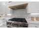 Close up of stainless steel stove and oven with white cabinets at 4329 Lambeth Dr, Raleigh, NC 27609