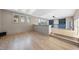 Bright living room with light hardwood floors and custom built-in shelves at 4329 Lambeth Dr, Raleigh, NC 27609