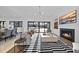 Living room with fireplace, TV, and sliding glass doors to the pool area at 4329 Lambeth Dr, Raleigh, NC 27609